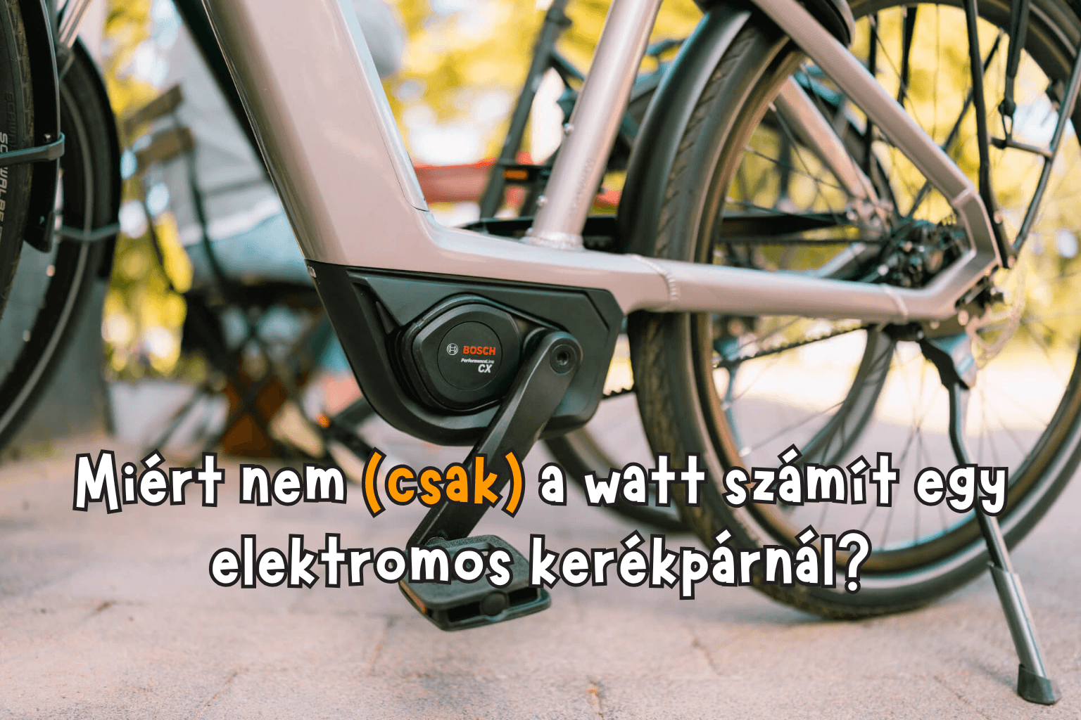 Ebike motorról közeli kép, rajta felirat: Miért nem (csak) a watt számít egy elektromos kerékpárnál?